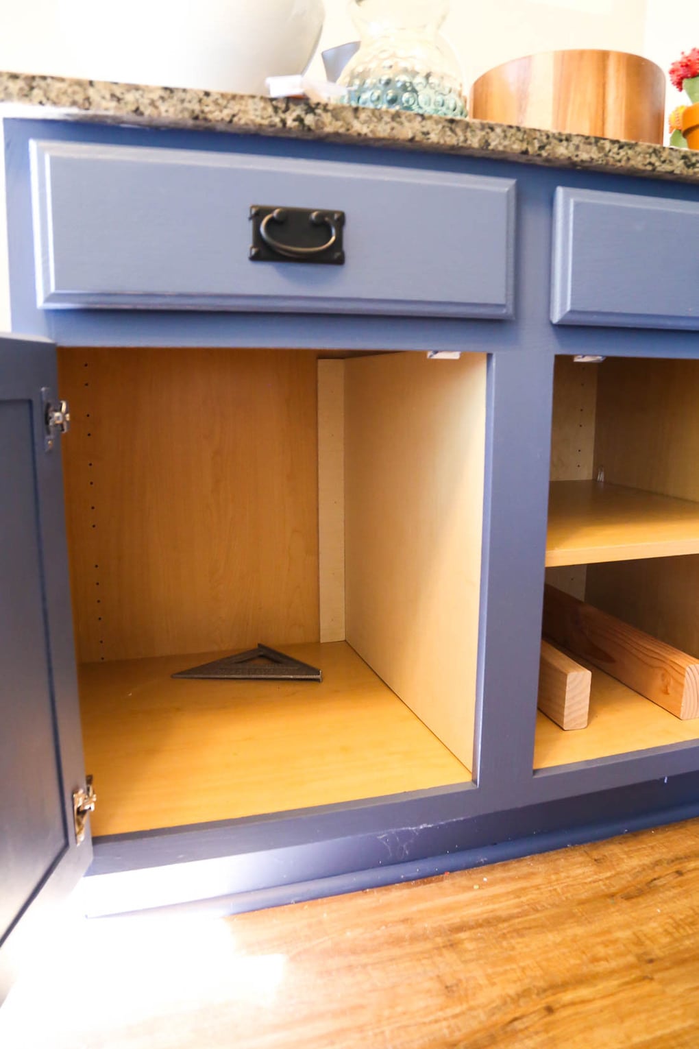 Cabinet with a hidden trash can