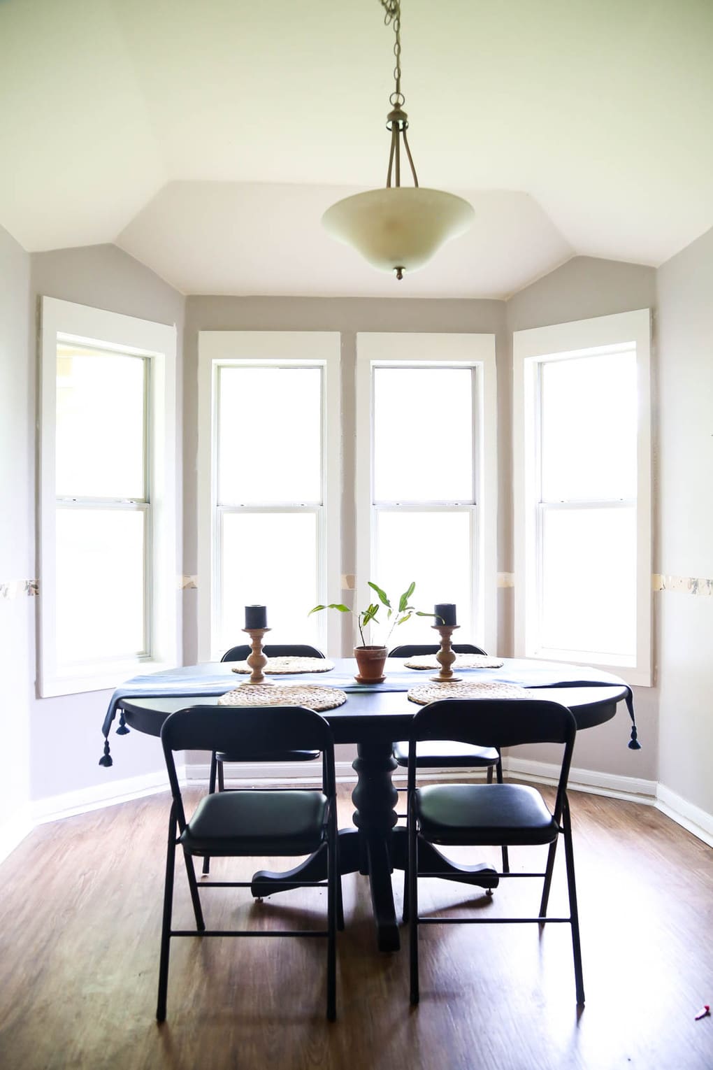 DIY window trim in bay window of dining room