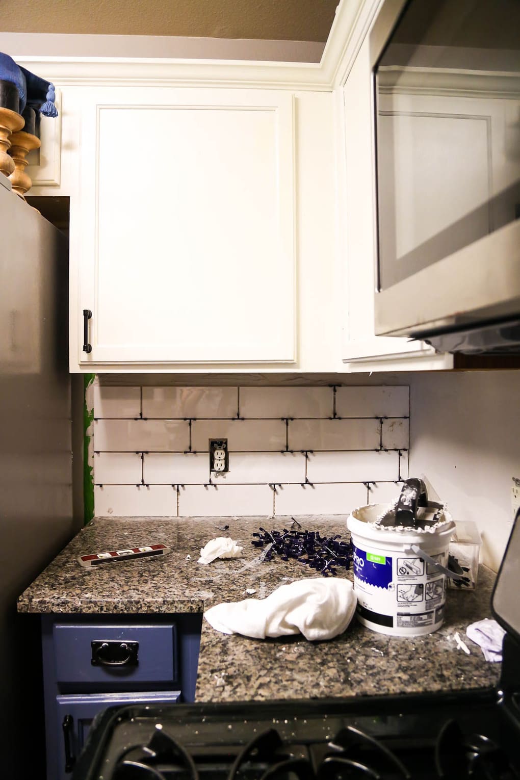 tile being installed for kitchen backsplash