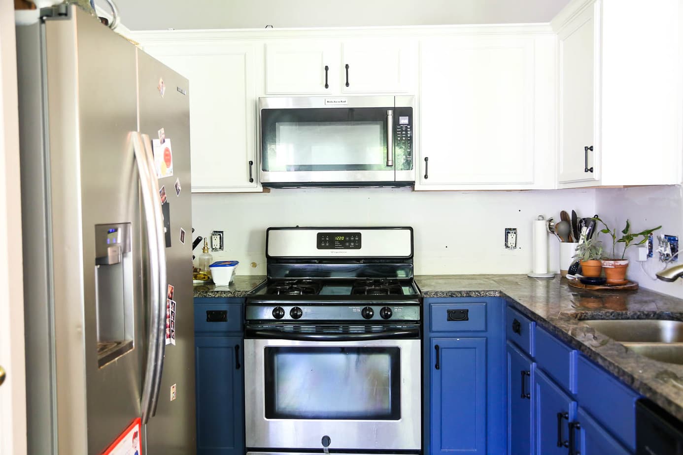 small kitchen with clean white backsplash