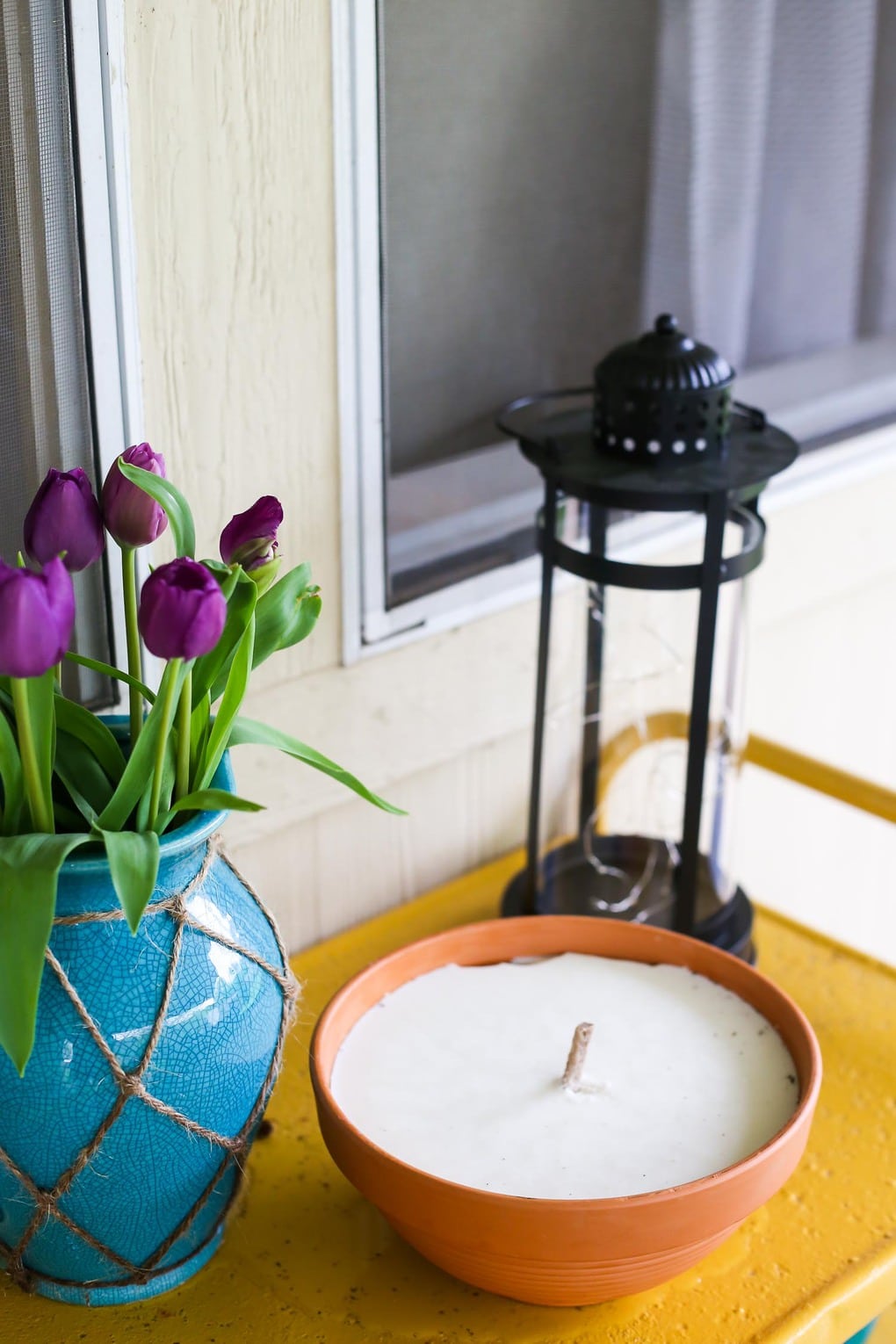 Yellow bar cart with large candle