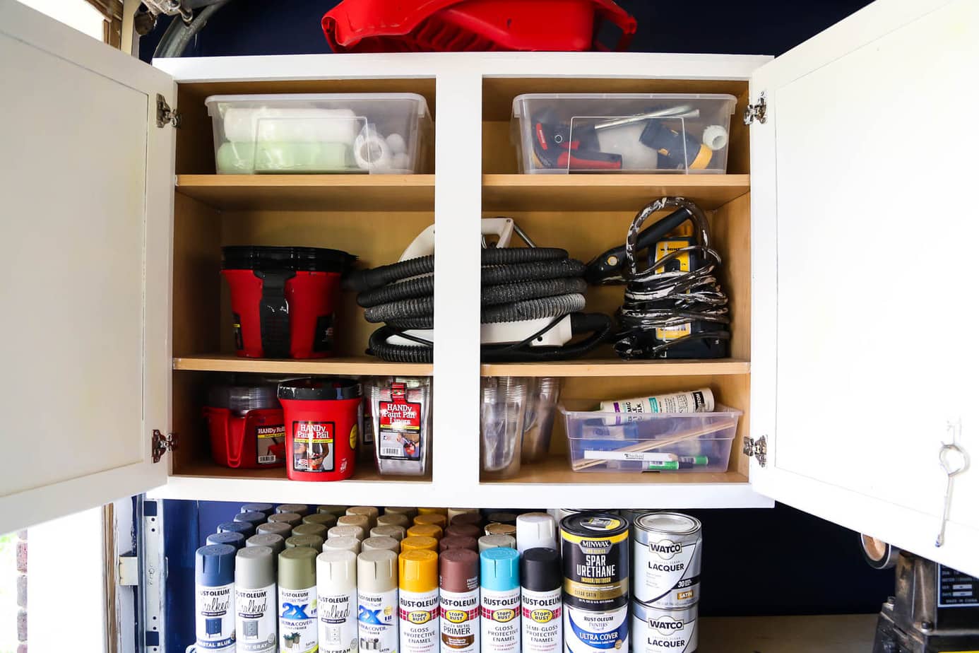 Using an old cabinet to organize paint supplies