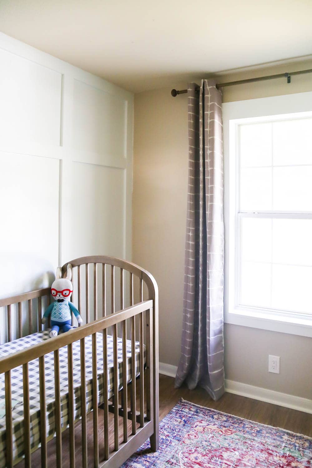 how to install window a nursery with a board & batten wall and DIY window trim around the windows