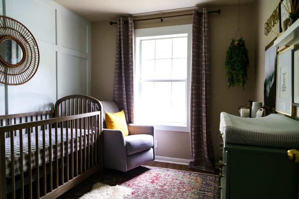 gender neutral nursery design with a board and batten accent wall 