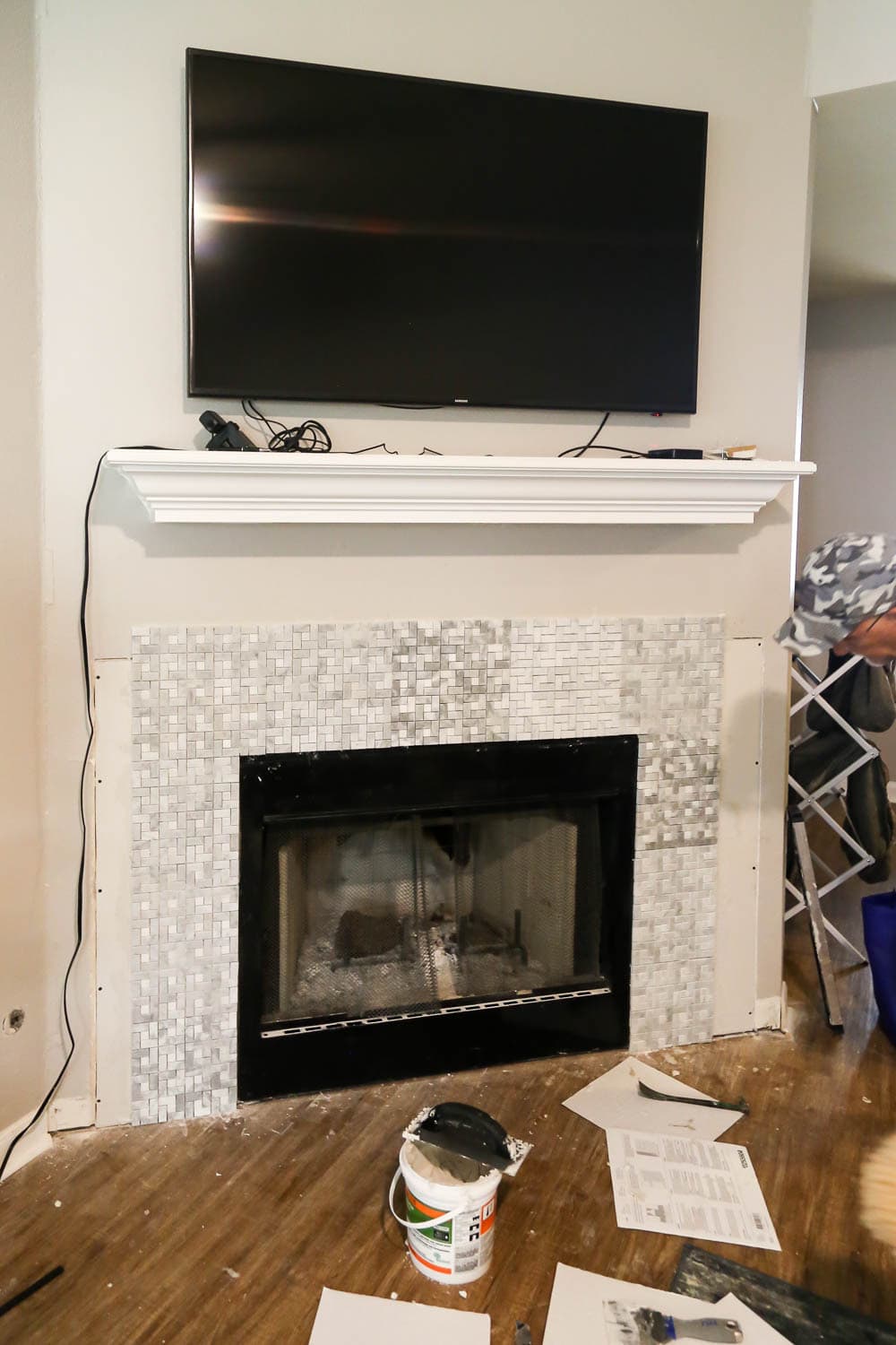 angled fireplace wall that has been recently tiled