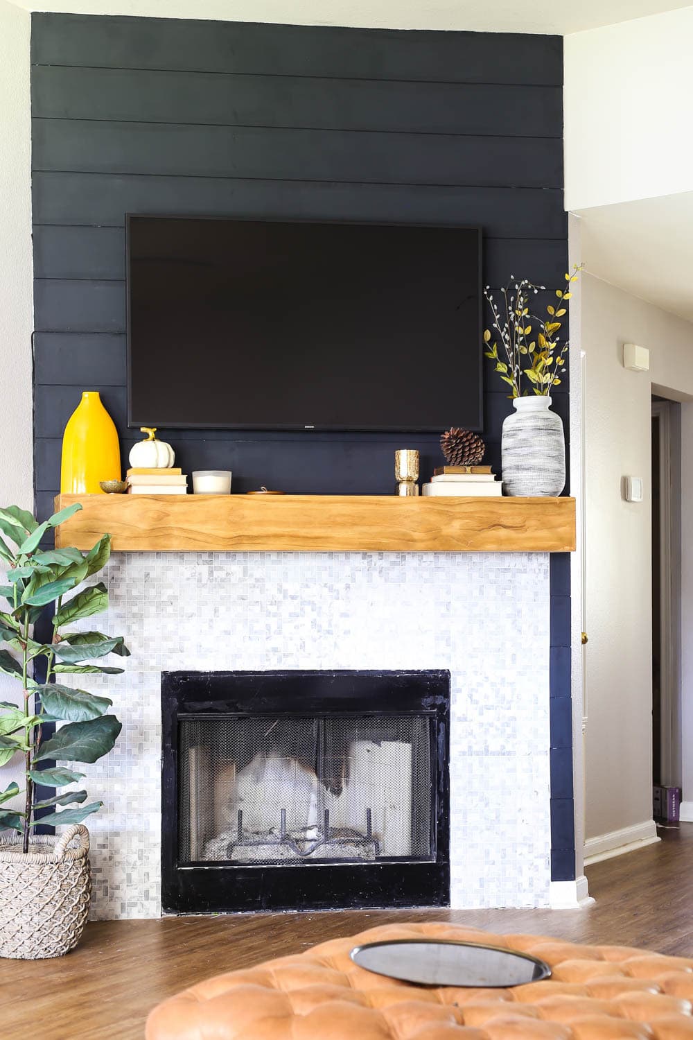 fireplace with black shiplap