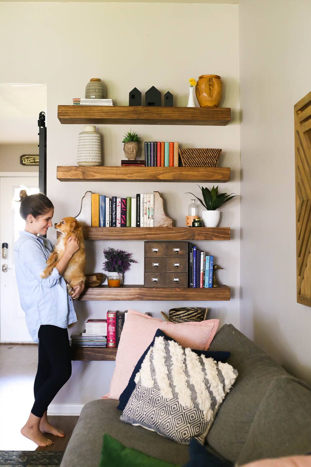 floating shelving with woman standing next to it