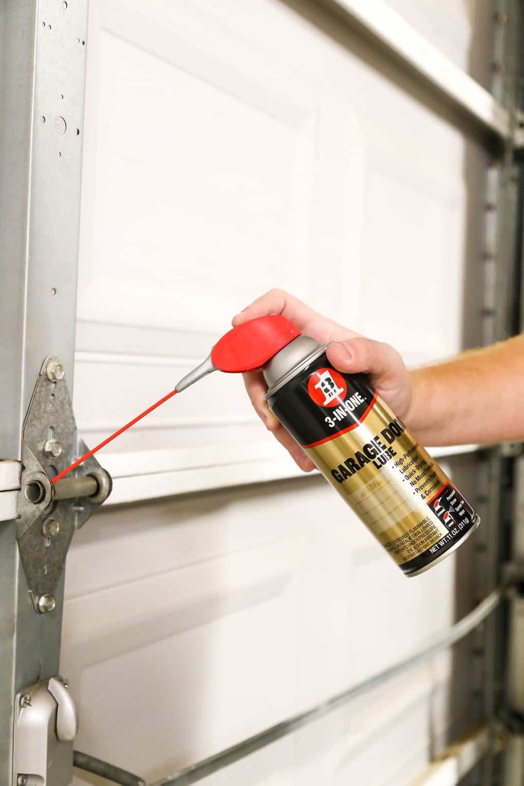 How to fix a squeaky garage door with 3 in One Garage Door Lube  #garagedoorrepair #diy 