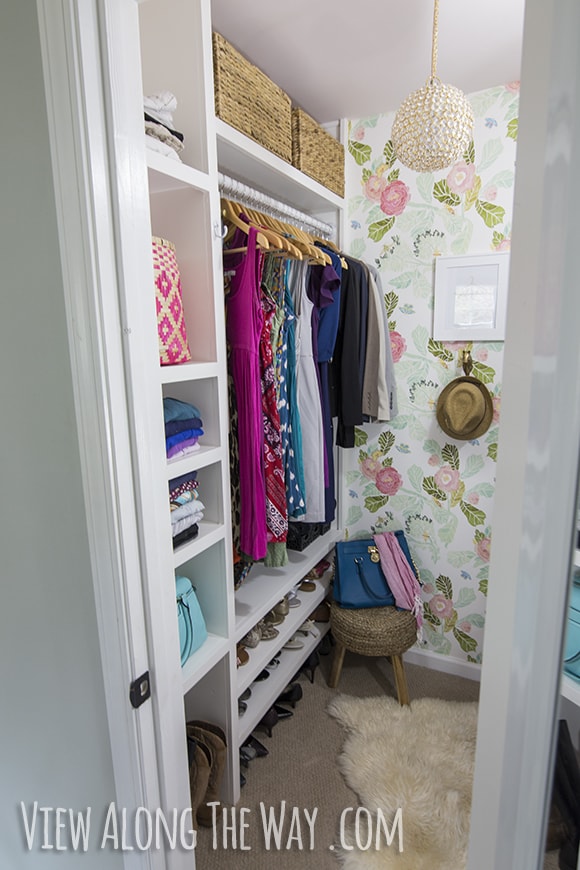 closet with wallpaper and DIY organization