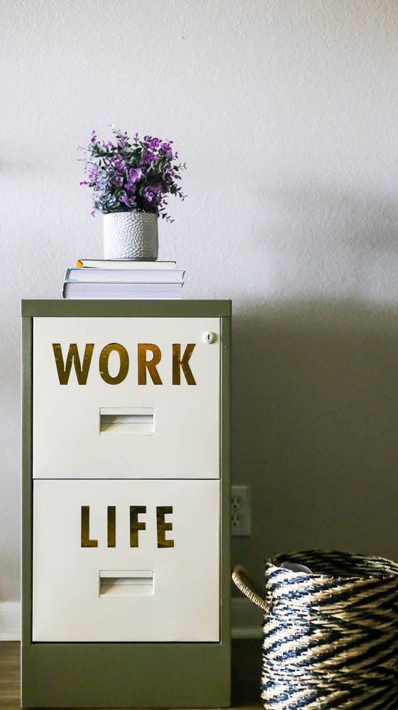 metal filing cabinet with word stickers