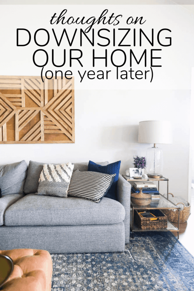 photo of living room with a text overlay - "thoughts on downsizing our home one year later"