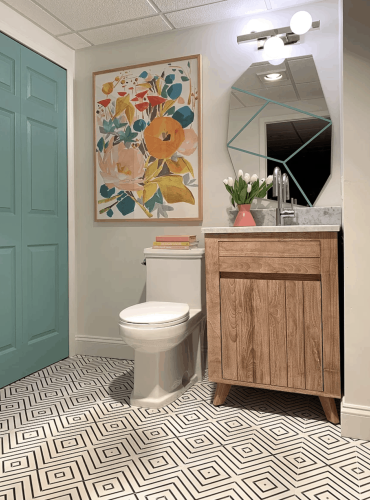 powder room with graphic tile and floral art