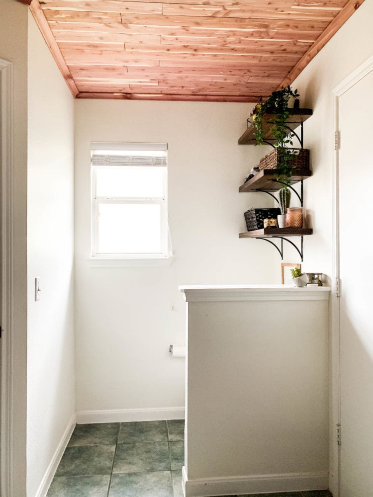 bright and airy bathroom with cedar lined ceiling