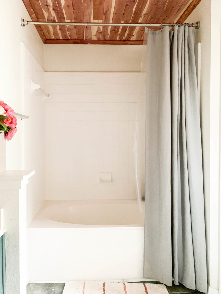 shower and tub area with cedar lined ceiling