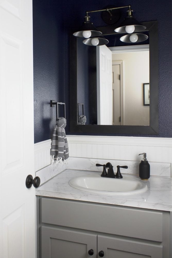 dark bathroom with navy walls