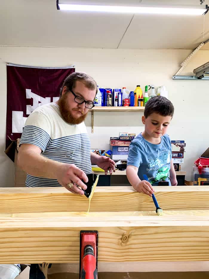 father and son working together to build a workbench