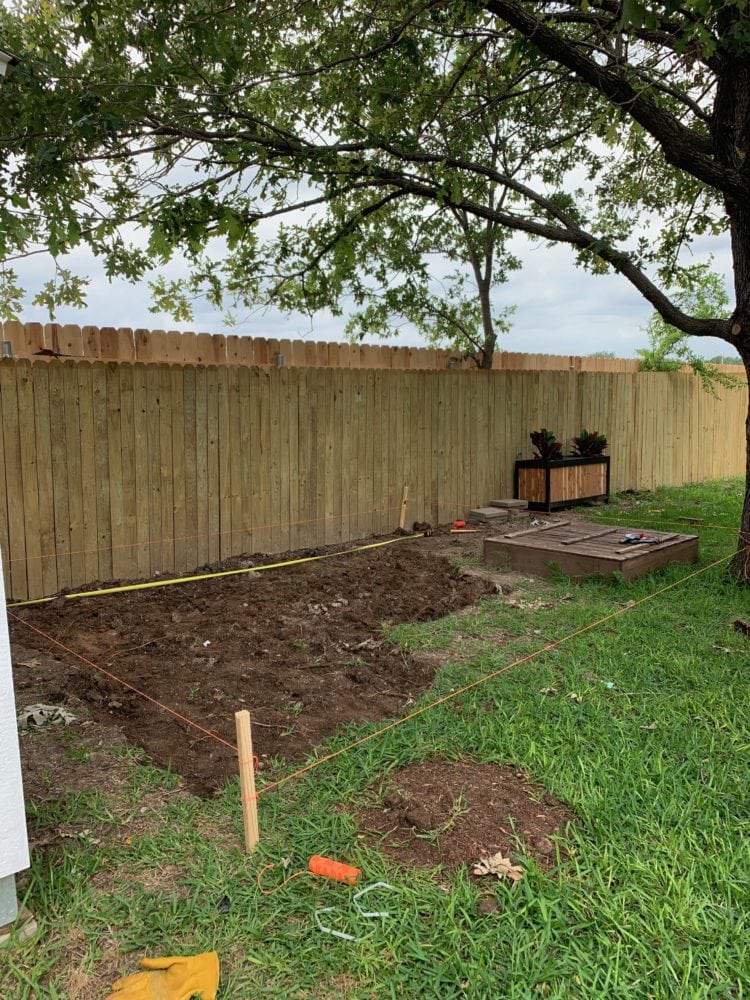 beginning of pea gravel patio - dirt dug out of ground