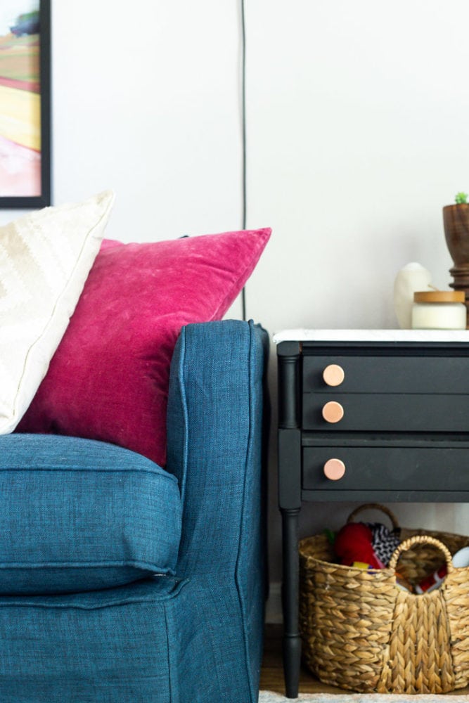 close up of Crate & Barrel Lounge II petite sofa with a Comfort Works slipcover next to a black side table