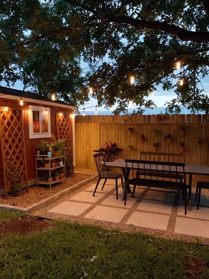 view of pea gravel patio at night