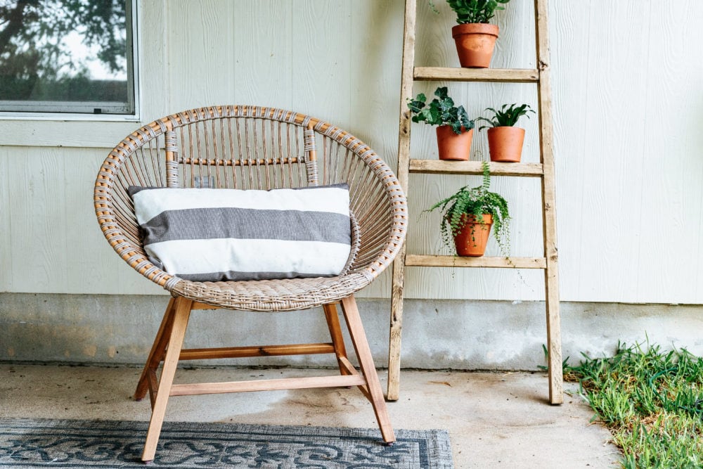 back porch with ladder with plants on it