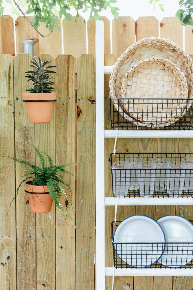 ladder with black wire baskets