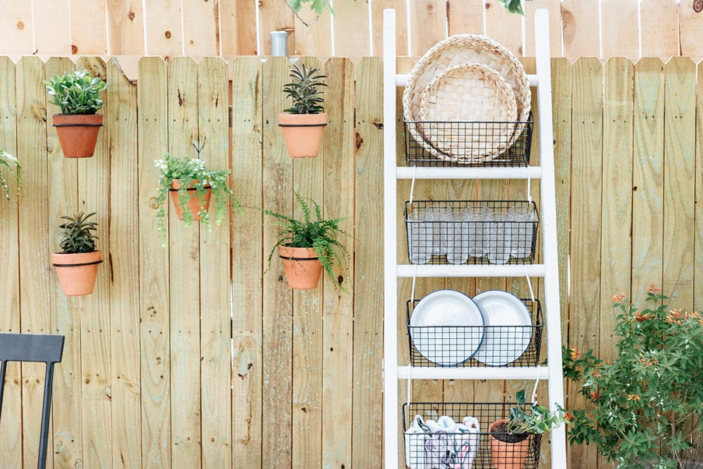 DIY ladder resting on a fence