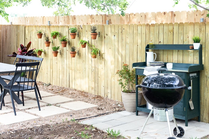 image of grill patio with a green grill cart