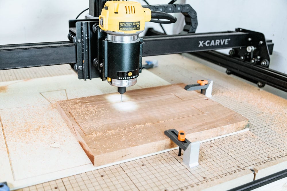 close up of X-Carve 3-d carving machine cutting out a small cutting board