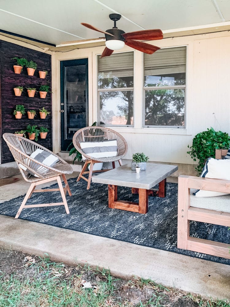 back porch with a plant wall to one side