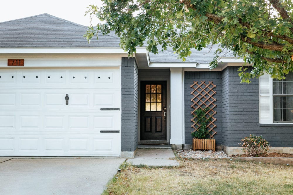 a small, one-story blue and white home