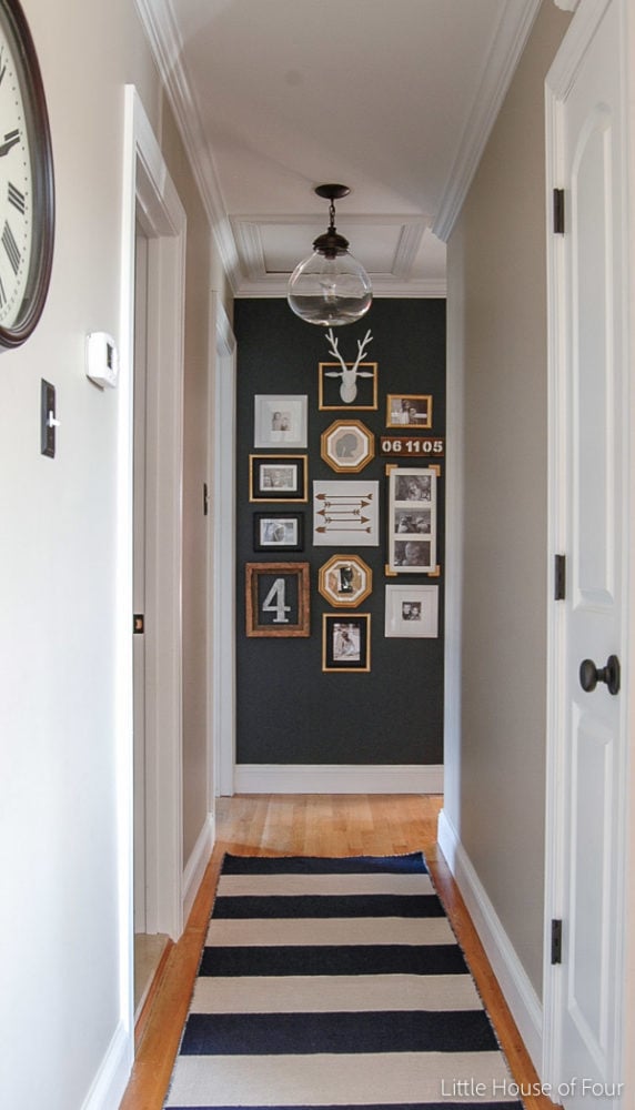 hallway with family photo gallery wall
