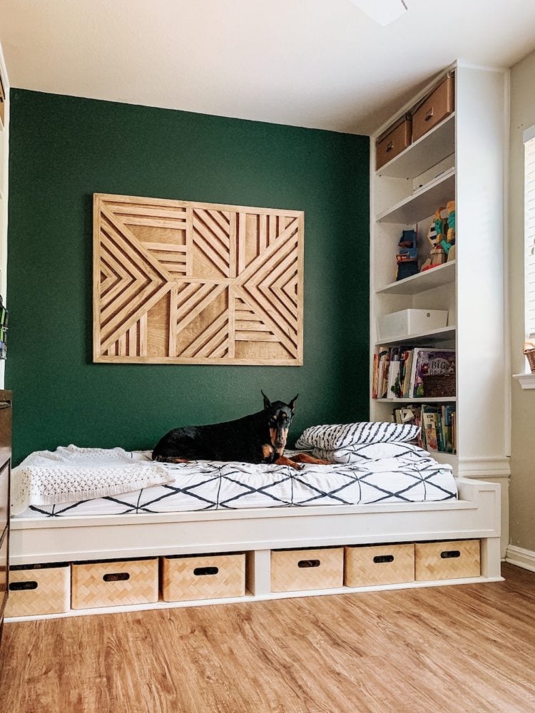 child's bedroom with a built in bed and shelving 