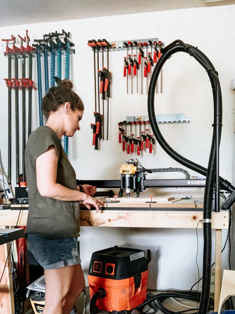 woman using an inventables x-carve machine