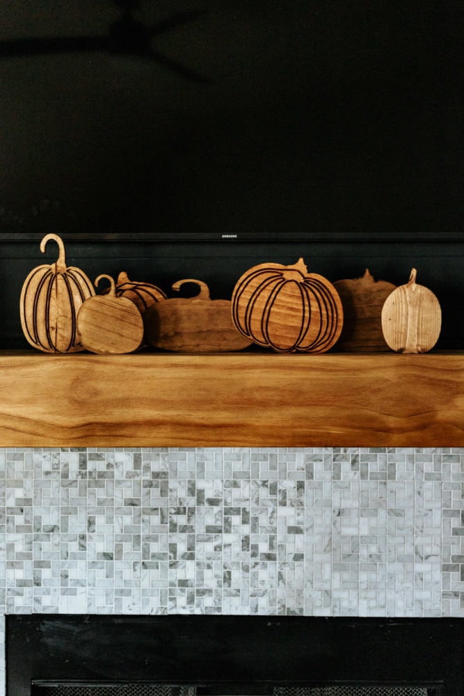 close up of 7 wooden pumpkins