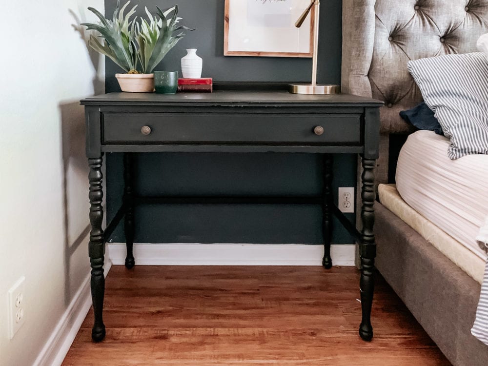 small vintage desk that has been painted black