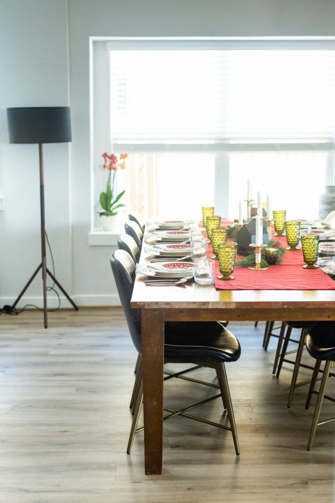 A large dining room table decorated for Christmas 