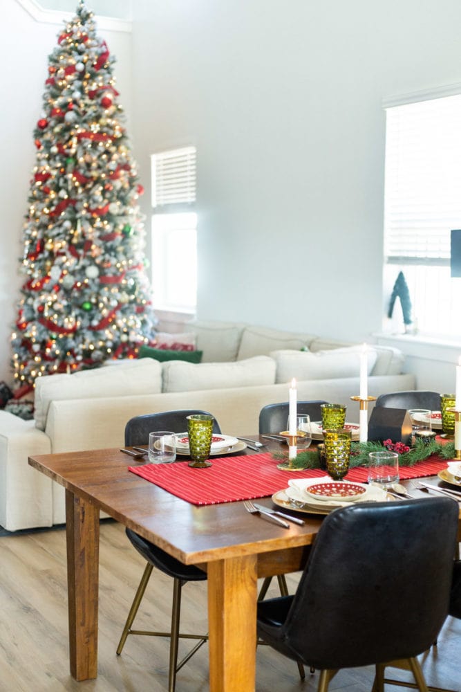 Christmas table scape with tree in the background 