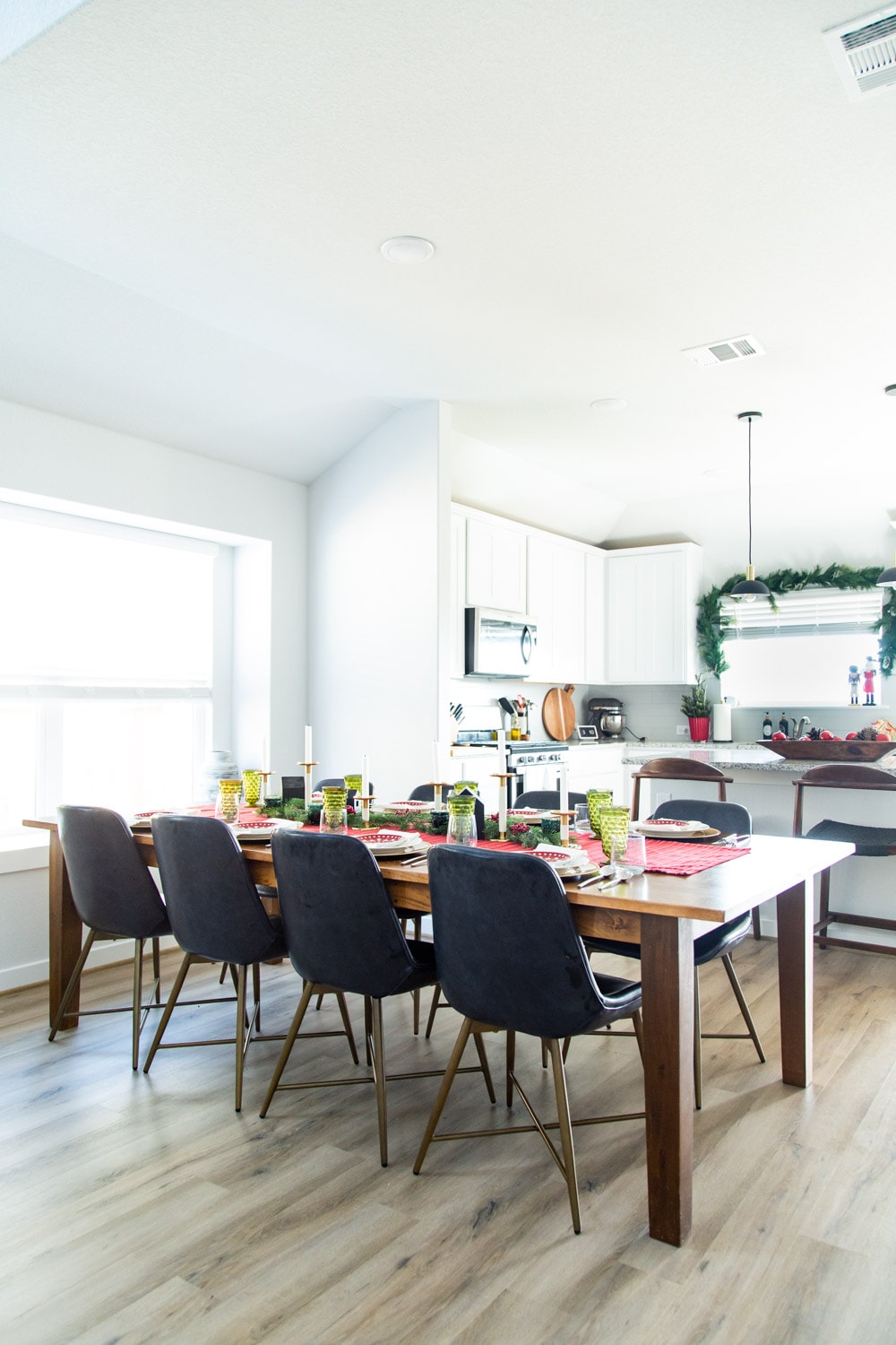Christmas table setting with kitchen in the background