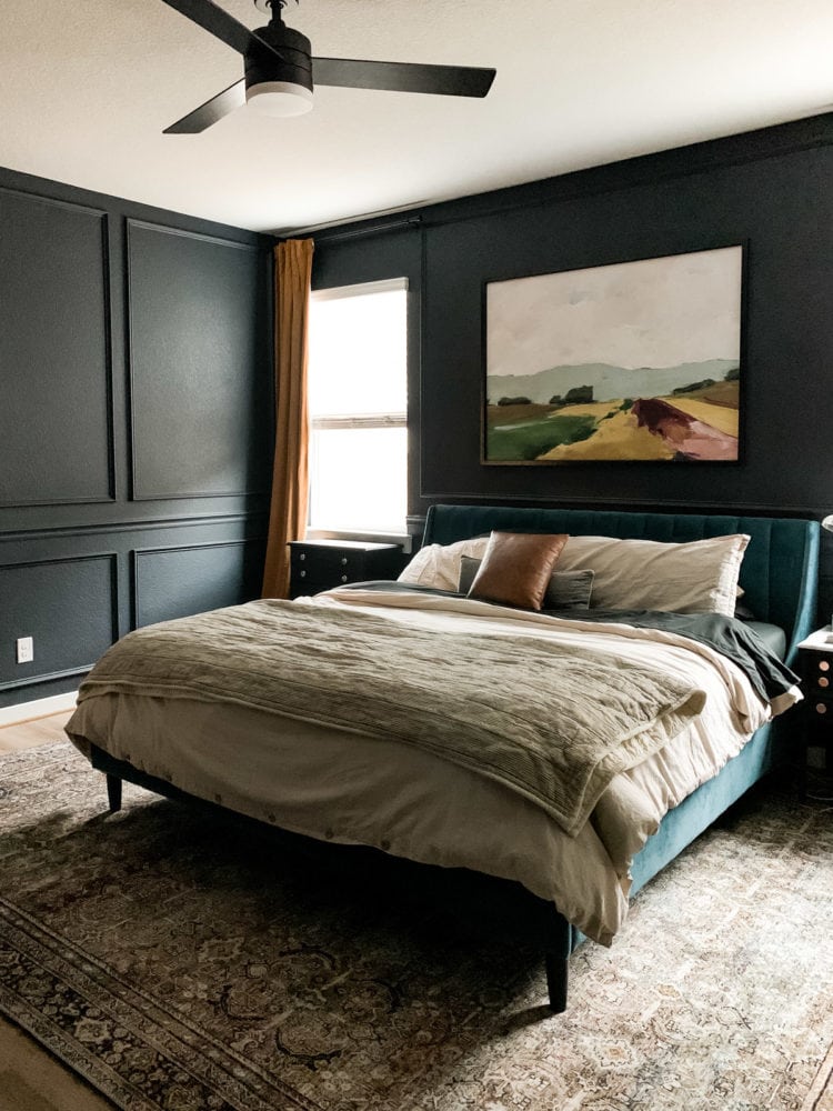 bedroom with dark trim and gold curtains