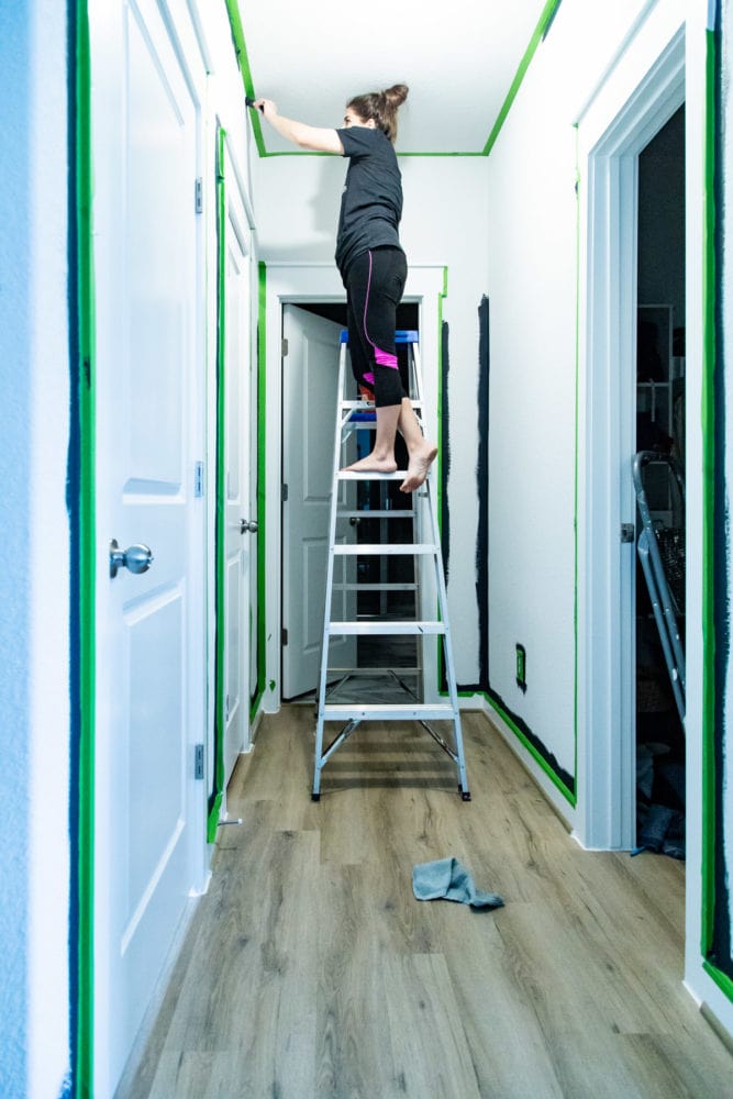 woman cutting in a ceiling