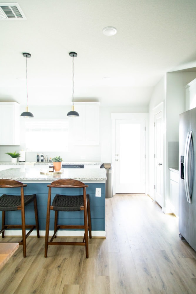 Kitchen with blue shiplapped kitchen island