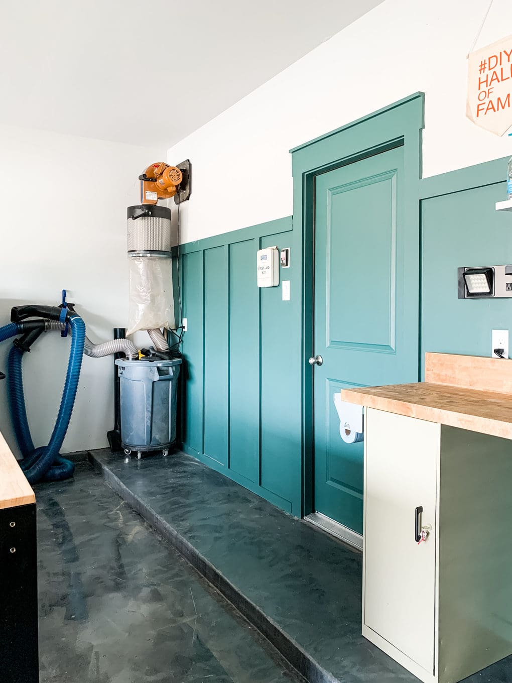 an organized garage with green board and batten