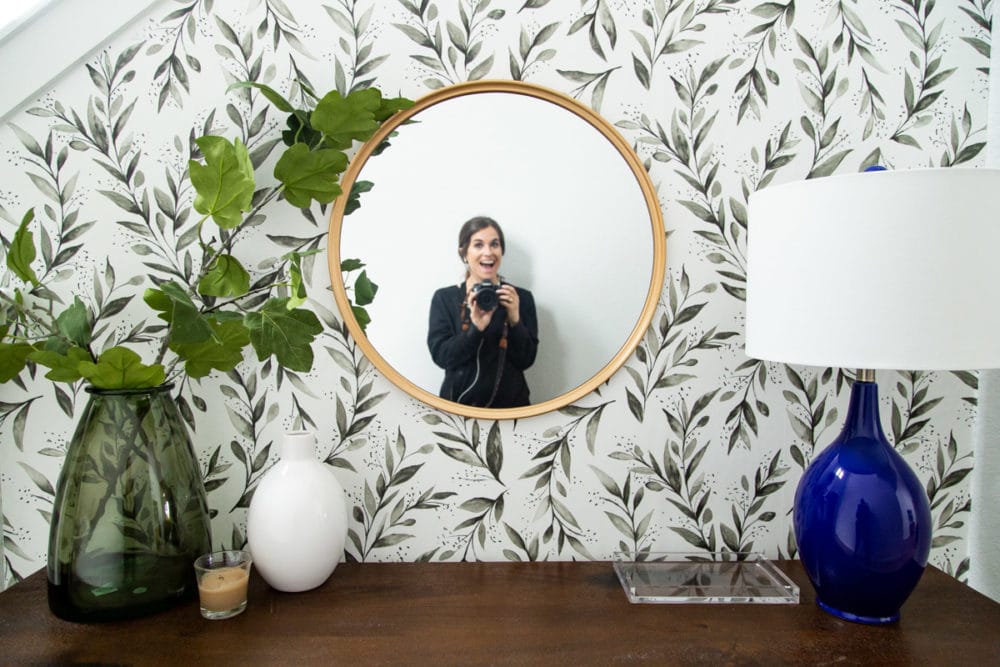 woman in mirror at entryway