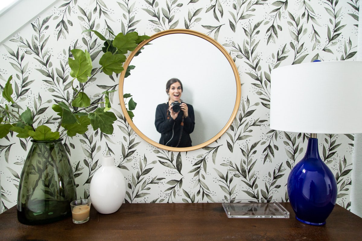 woman in mirror at entryway