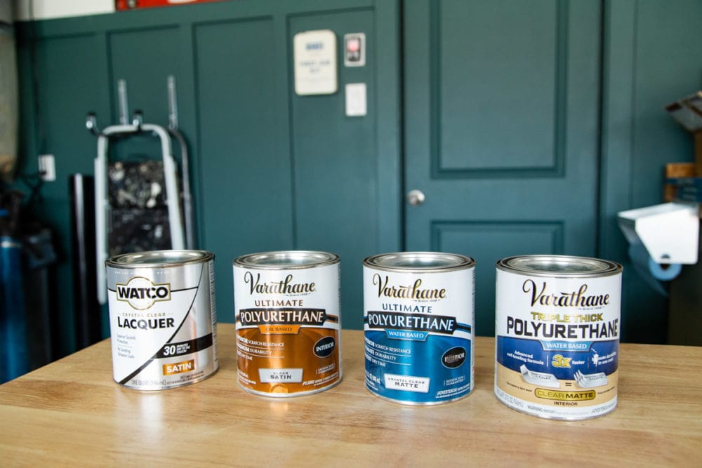 a collection of cans of varathane finishes