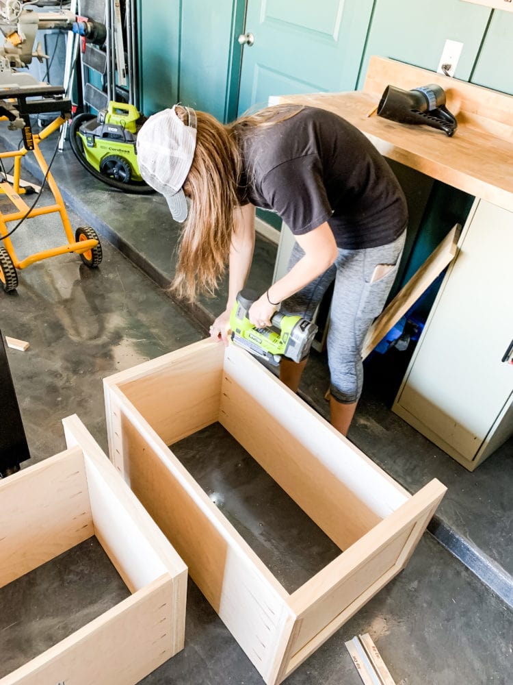 Woman using a nail gun