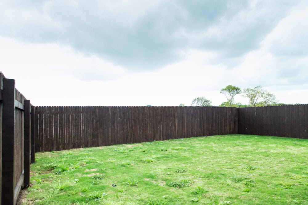 a back fence that has been stained