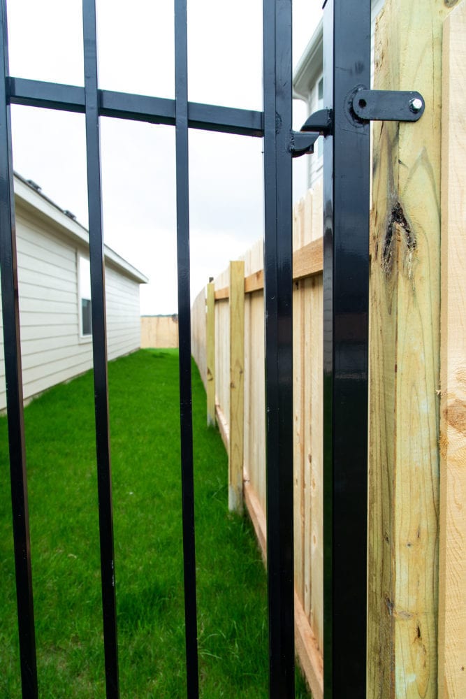 the back side of a fence that has been stained