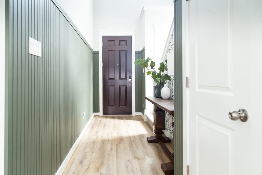 entry with dark green beadboard