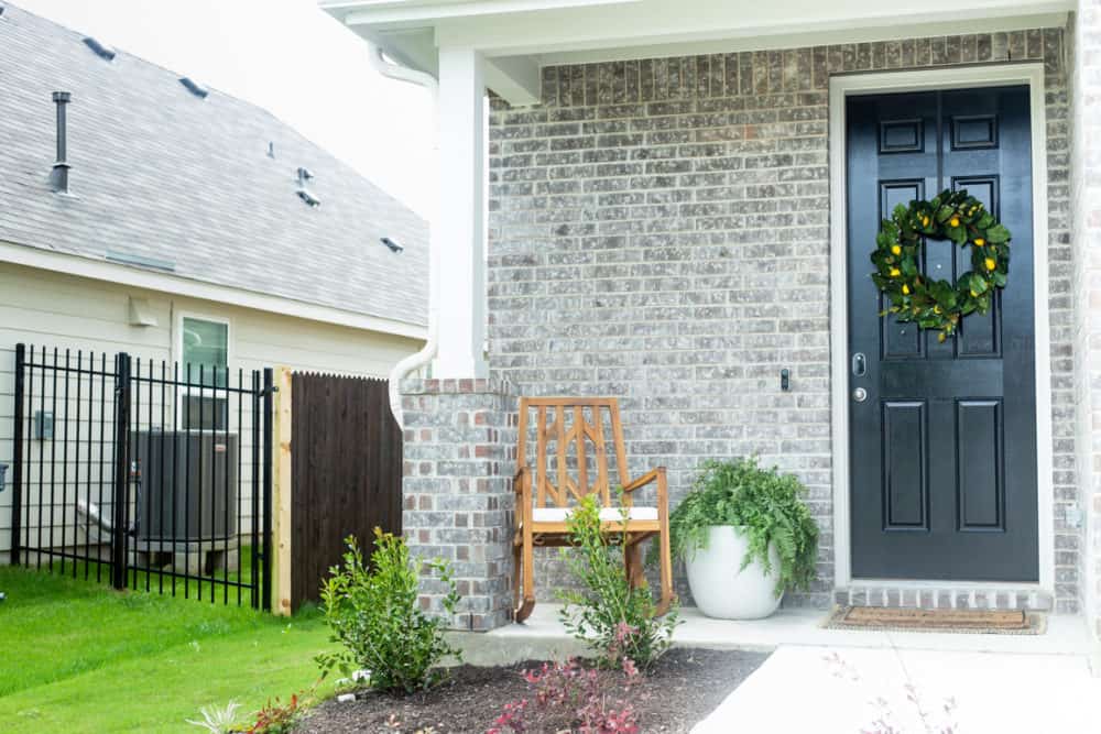 Front porch with rocking chair and spring wreath 